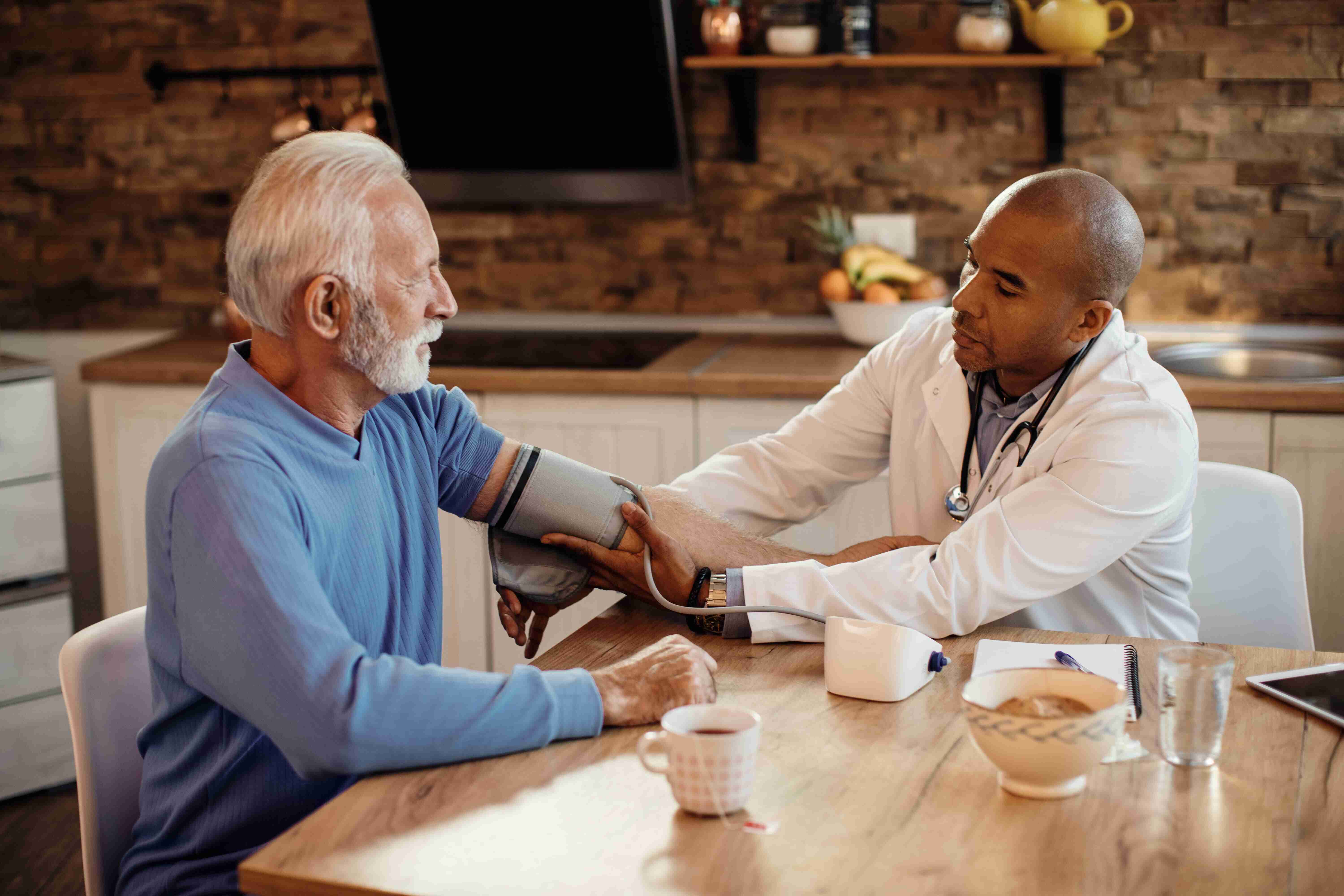 Heartwell Support worker helping an elderly client with daily homecare support